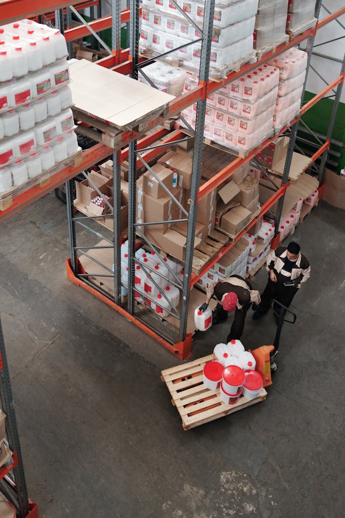 why-choose-us Warehouse workers organizing inventory on shelves, enhancing logistics efficiency.